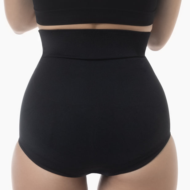 Back view of women’s black high-waisted shapewear brief worn by model
