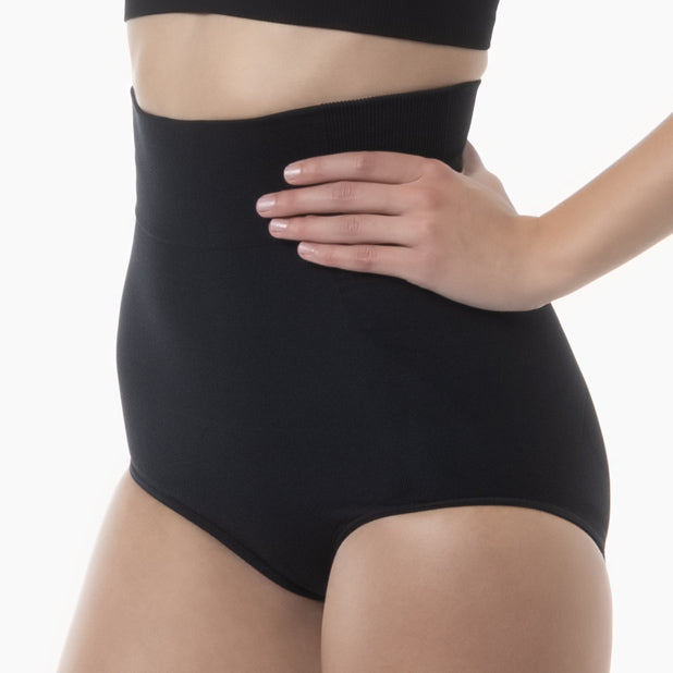 Left side view of women’s black high-waisted shapewear brief worn by model