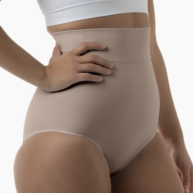 Right side view of women’s nude high-waisted shapewear brief worn by model