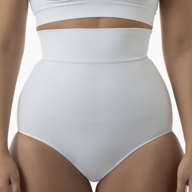 Front view of women’s white high-waisted shapewear brief worn by model