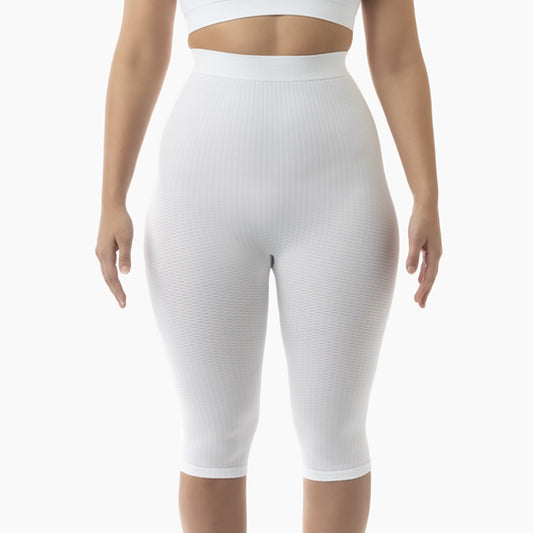 Front view of women’s white high-waist anti-cellulite capri shapewear worn by model