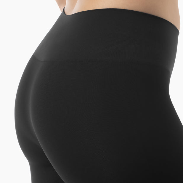 Detail of women’s black shaping capri leggings worn by model – product 604y