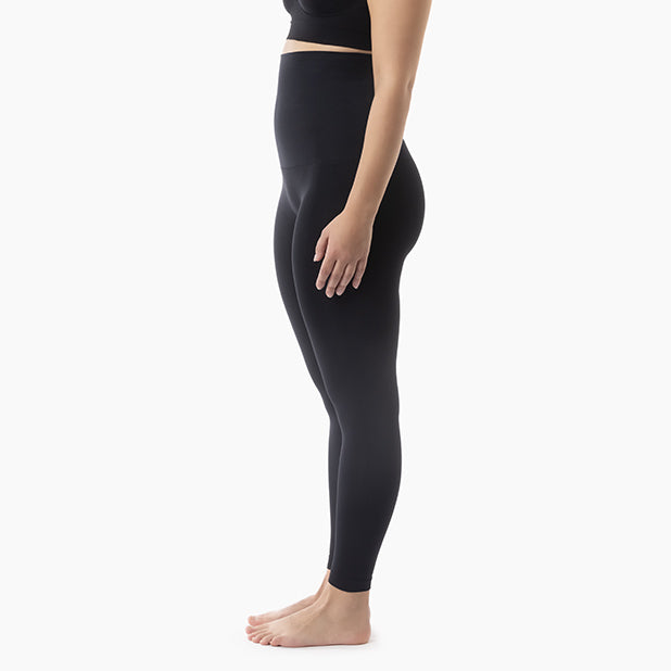 Left side view of women’s black high-waisted tummy control leggings worn by model – product 609y