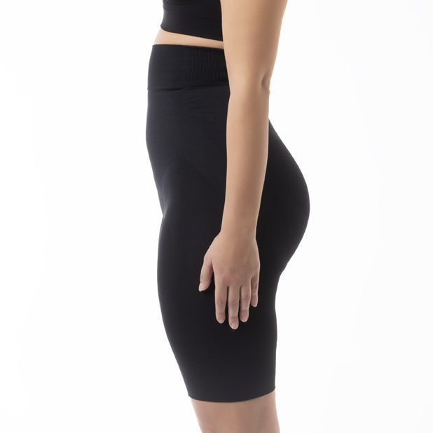 Left side view of women’s black high-waist shapewear shorts worn by model – product 603