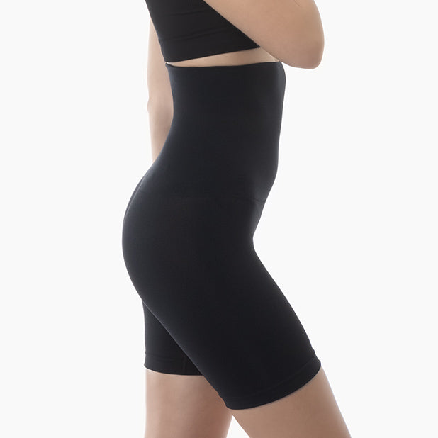 Right side view of women’s black seamless shaping high waist shorts worn by model – product 603y