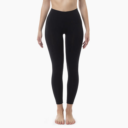 Front view of women’s black mid-waisted tummy control leggings worn by model
