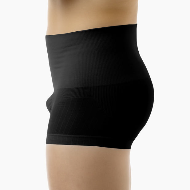 Left side view of men’s black shapewear stretch cotton boxer worn by model