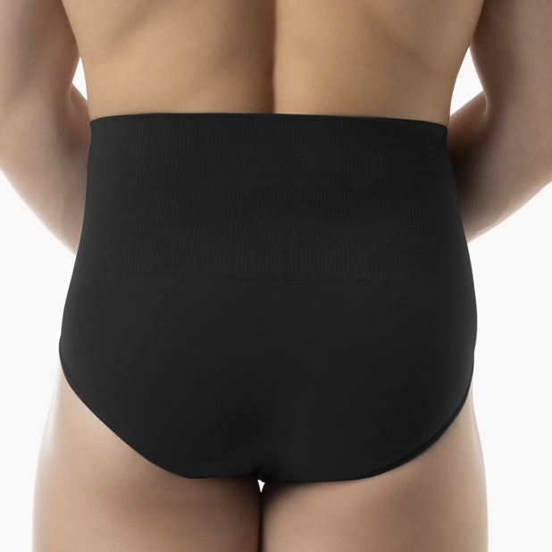 Back view of men’s black tummy control shapewear brief worn by model