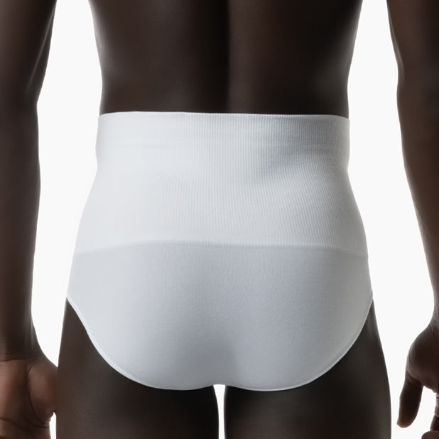 Back view of men’s white tummy control shapewear brief worn by model