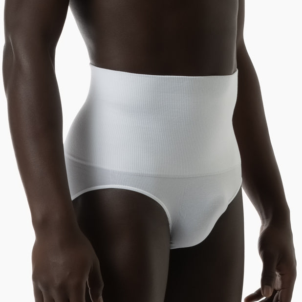 Right side view of men’s white tummy control shapewear brief worn by model
