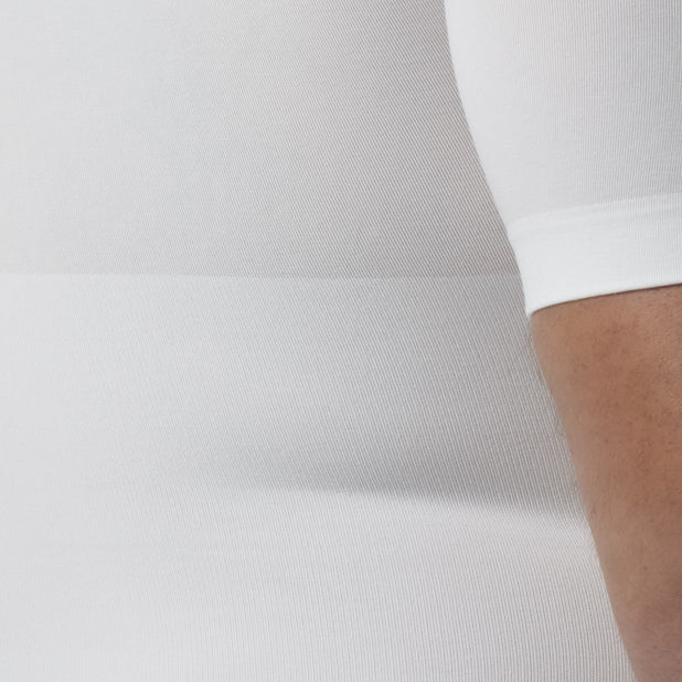 Back detail of men’s white body shaper slimming t-shirt with tummy control worn by model