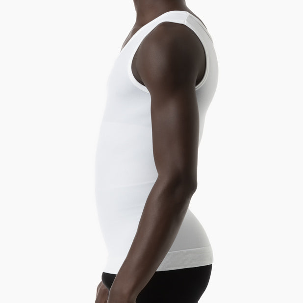 Left side view of men’s white slimming compression tank top worn by model – product 417b