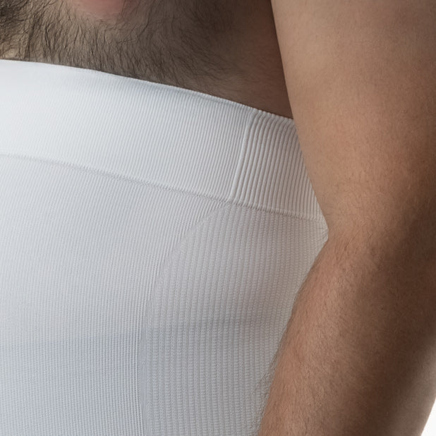 Front detail view of men’s white shapewear waist cincher worn by model