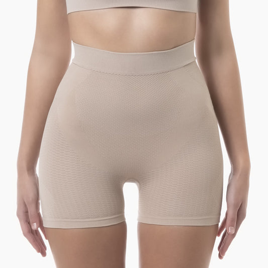 Front view of women’s powder mid-thigh shapewear short with anti-cellulite control worn by modelUSA