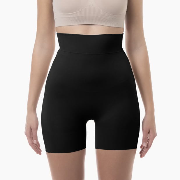 Front view of women’s black high-waist mid-thigh shapewear short worn by model