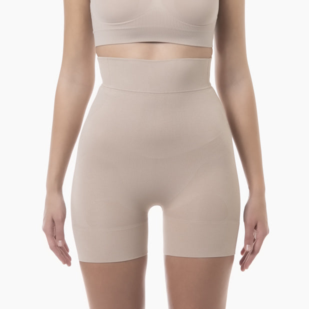 Front view of women’s powder high-waist mid-thigh shapewear short worn by model