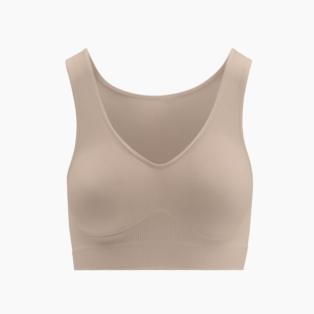 Front view of powder shapewear bra with wide shoulder straps on mannequin