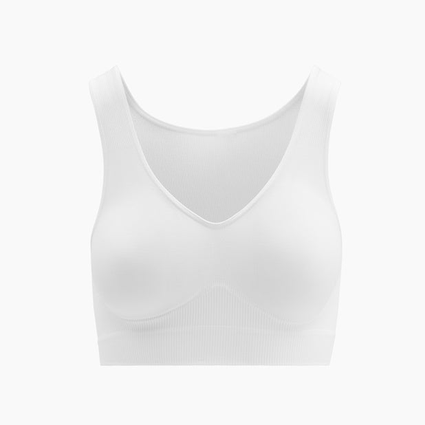 Front view of white shapewear bra with wide shoulder straps on mannequin