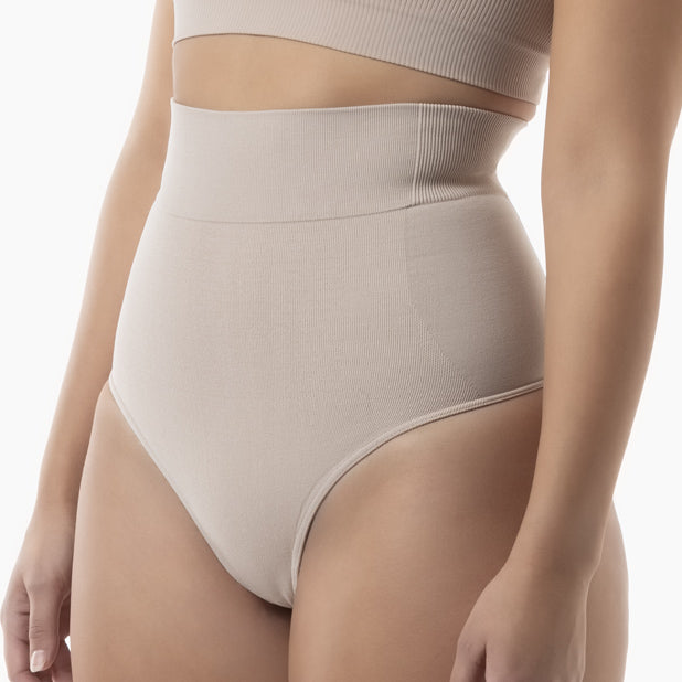 Right side view of women’s powder high waist shaping thong worn by model