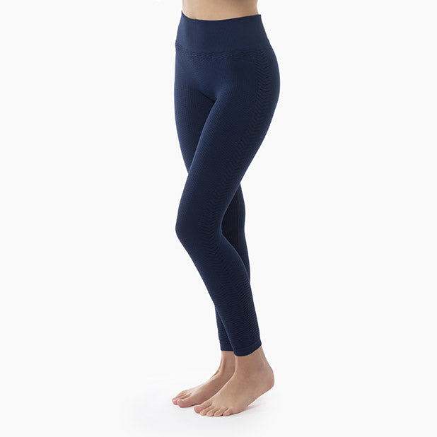 Left side view of women’s blue anti-cellulite compression leggings worn by model – product 1109